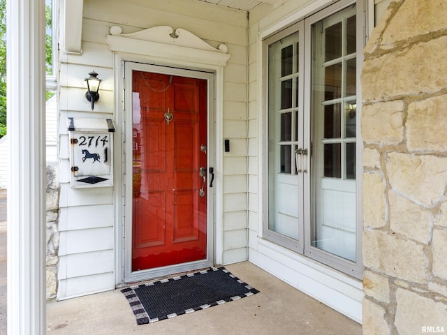 2714 W Kenwood Ave, West Peoria, IL 61604 - doorway to property featuring stone siding and french doors
