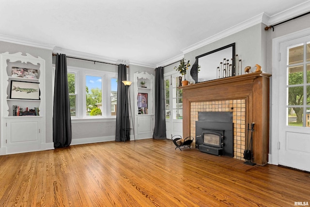 2714 W Kenwood Ave, West Peoria, IL 61604 - unfurnished living room with crown molding, wood finished floors, and baseboards