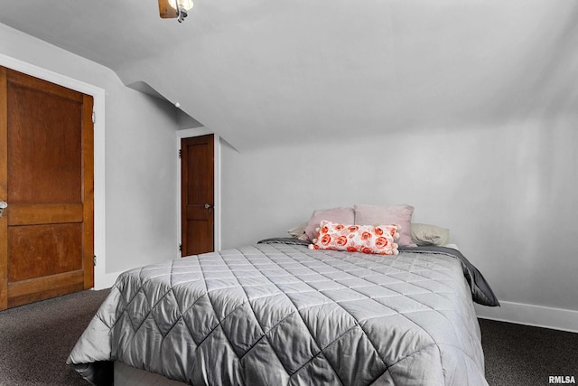 2714 W Kenwood Ave, West Peoria, IL 61604 - carpeted bedroom featuring lofted ceiling and baseboards