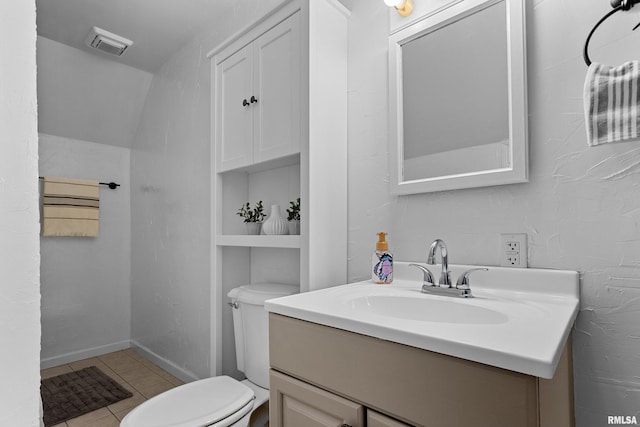 2714 W Kenwood Ave, West Peoria, IL 61604 - bathroom featuring vanity, toilet, tile patterned floors, and baseboards