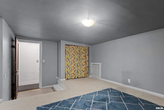 2714 W Kenwood Ave, West Peoria, IL 61604 - unfurnished bedroom featuring carpet and baseboards