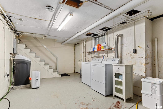 2714 W Kenwood Ave, West Peoria, IL 61604 - unfinished below grade area featuring washer and dryer and stairway