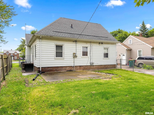 2714 W Kenwood Ave, West Peoria, IL 61604 - back of property with roof with shingles and a patio
