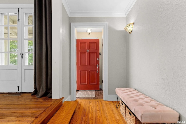 2714 W Kenwood Ave, West Peoria, IL 61604 - entrance foyer with light wood-type flooring, crown molding, baseboards, and a textured wall
