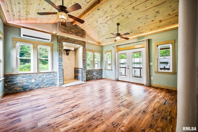 21016 N US Highway 24, Canton, IL 61520 - spare room with a wall mounted air conditioner, wood finished floors, ornate columns, and ceiling fan