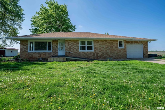 single story home featuring an attached garage, brick siding, and a front lawn