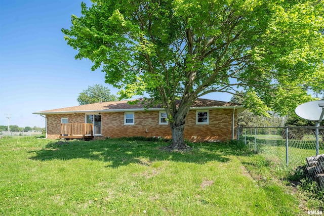 rear view of house featuring brick siding