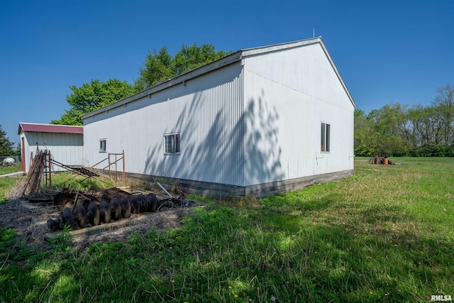 view of property exterior featuring a lawn