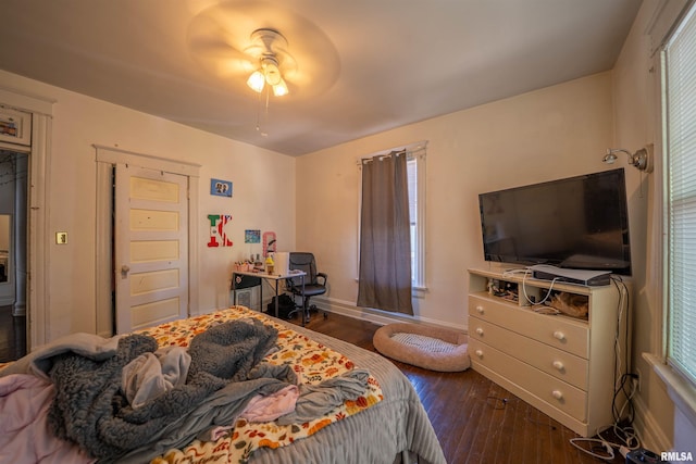 1624 W Barker Ave, Peoria, IL 61606 - bedroom with wood-type flooring, baseboards, multiple windows, and ceiling fan