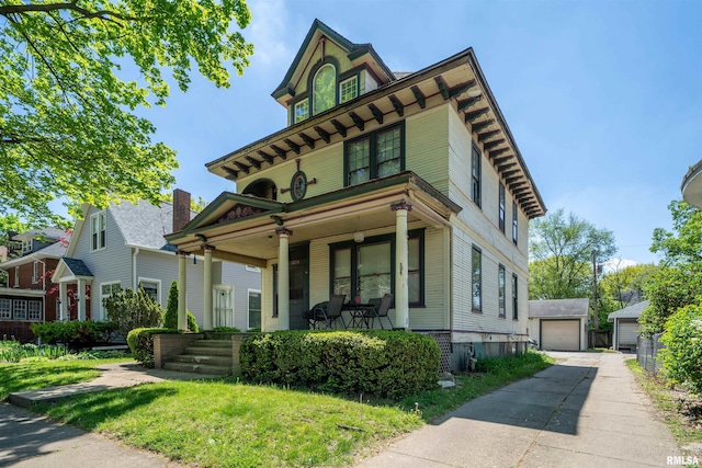 1624 W Barker Ave, Peoria, IL 61606 - view of front of home featuring covered porch, a garage, and an outdoor structure