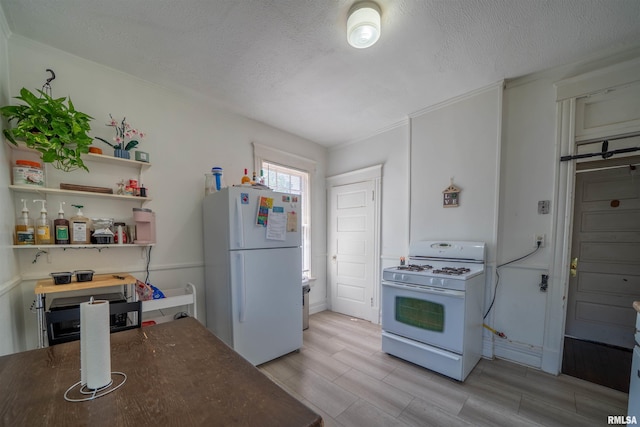 1624 W Barker Ave, Peoria, IL 61606 - kitchen with white appliances, a textured ceiling, wood finish floors, ornamental molding, and open shelves