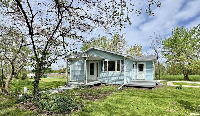 rear view of house with a lawn