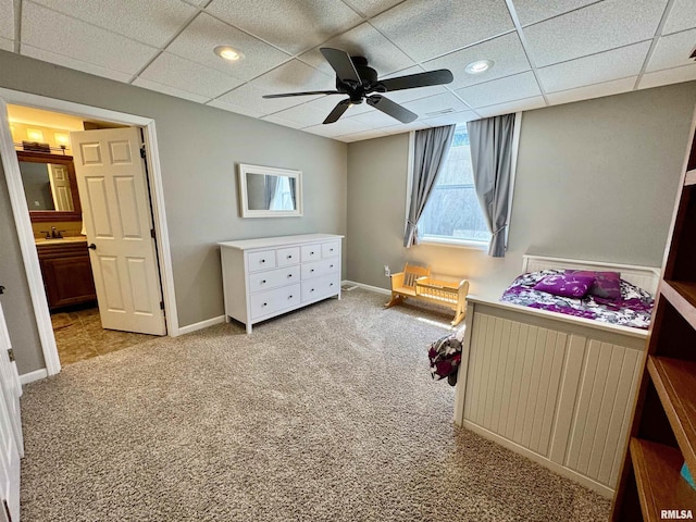 bedroom with light colored carpet, a paneled ceiling, recessed lighting, baseboards, and ceiling fan