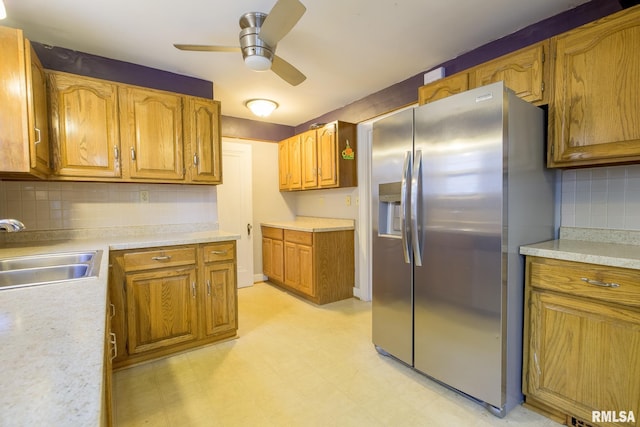 606 W Maywood Ave, Peoria, IL 61604 - kitchen with stainless steel refrigerator with ice dispenser, ceiling fan, backsplash, and brown cabinetry