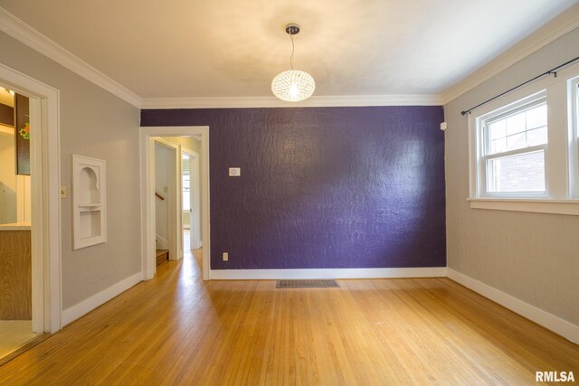 606 W Maywood Ave, Peoria, IL 61604 - unfurnished room with wood finished floors and ornamental molding