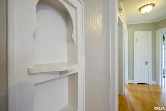 606 W Maywood Ave, Peoria, IL 61604 - hall with wood finished floors and crown molding