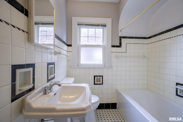 606 W Maywood Ave, Peoria, IL 61604 - full bathroom with tile walls and a bath