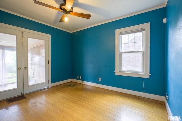 606 W Maywood Ave, Peoria, IL 61604 - spare room with wood finished floors, crown molding, french doors, and ceiling fan