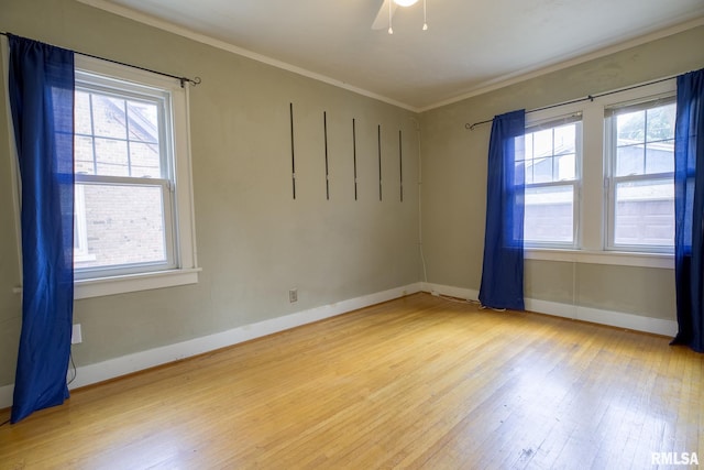 606 W Maywood Ave, Peoria, IL 61604 - spare room with wood-type flooring, plenty of natural light, and ornamental molding