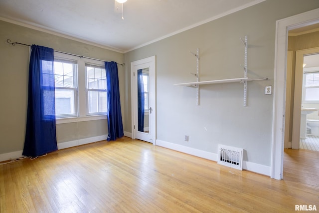 606 W Maywood Ave, Peoria, IL 61604 - spare room with wood finished floors and crown molding
