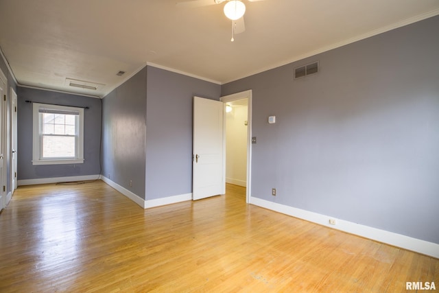 606 W Maywood Ave, Peoria, IL 61604 - empty room featuring crown molding, light wood-style flooring, and a ceiling fan