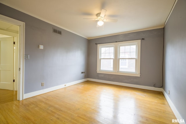 606 W Maywood Ave, Peoria, IL 61604 - spare room with ceiling fan, light wood-style flooring, and crown molding