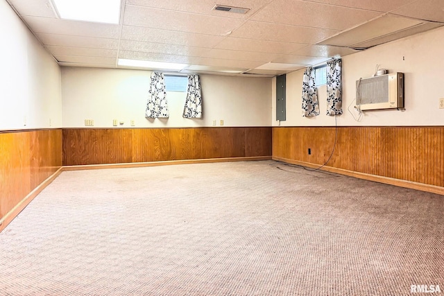 606 W Maywood Ave, Peoria, IL 61604 - basement with a drop ceiling, carpet, wooden walls, wainscoting, and electric panel