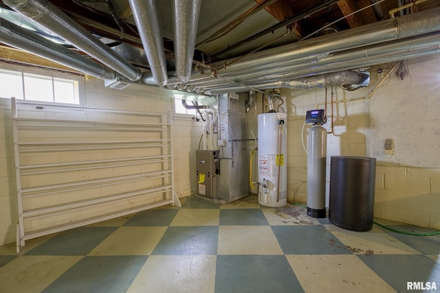 606 W Maywood Ave, Peoria, IL 61604 - below grade area with gas water heater, tile patterned floors, heating unit, a water softener, and healthy amount of natural light