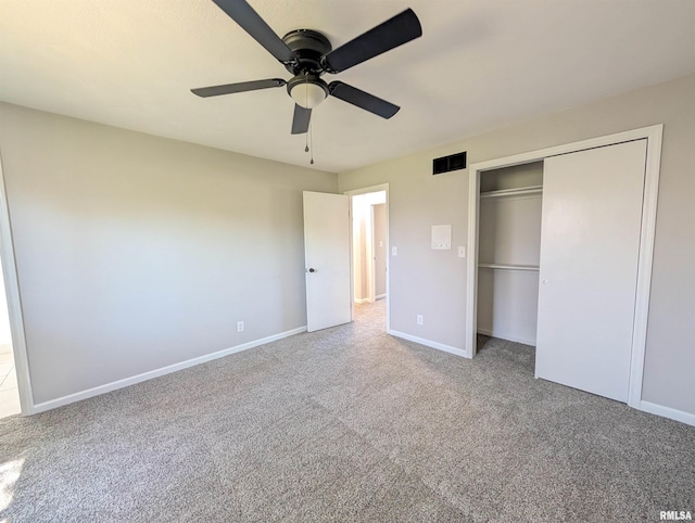 unfurnished bedroom featuring carpet, baseboards, a closet, and ceiling fan