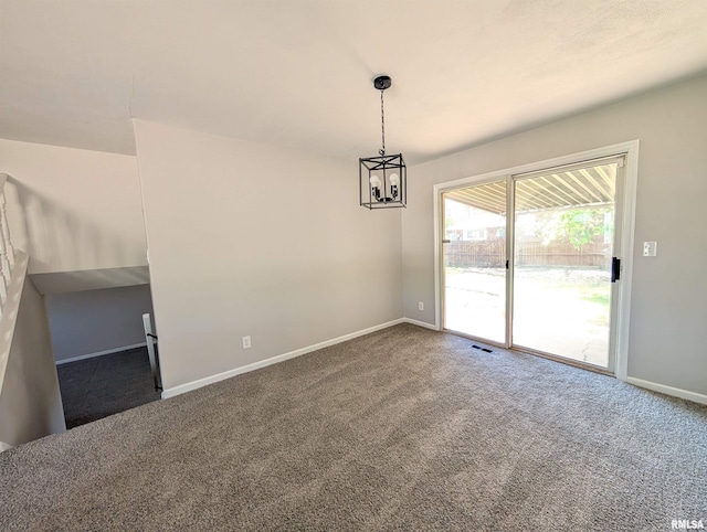 unfurnished dining area featuring carpet floors, baseboards, and a chandelier
