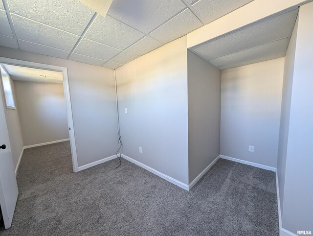 empty room featuring carpet flooring and baseboards