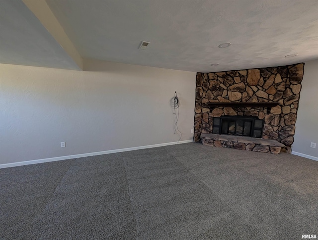 unfurnished living room featuring baseboards and a fireplace