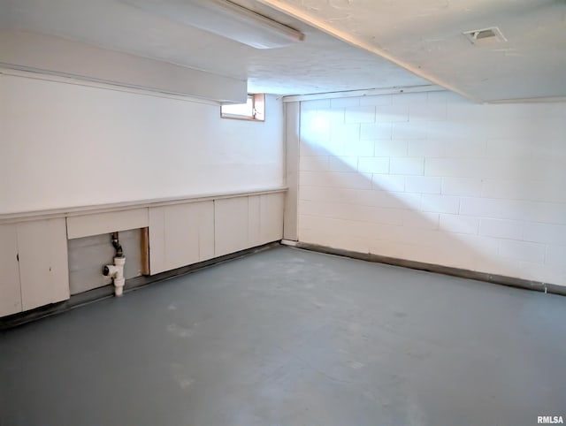 below grade area with concrete block wall