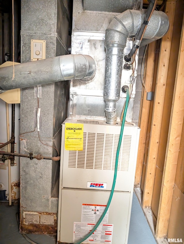 utility room featuring heating unit