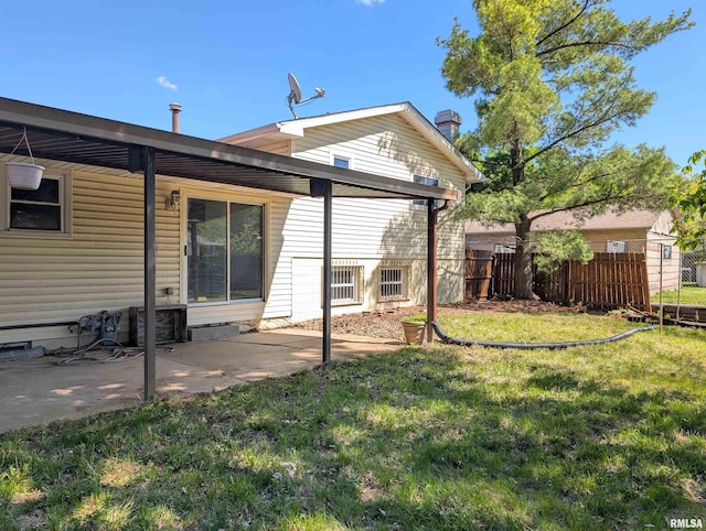 back of house with a patio