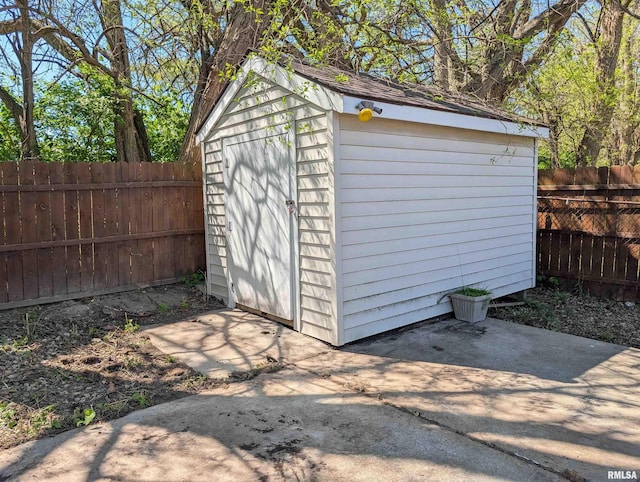 view of shed featuring a fenced backyard