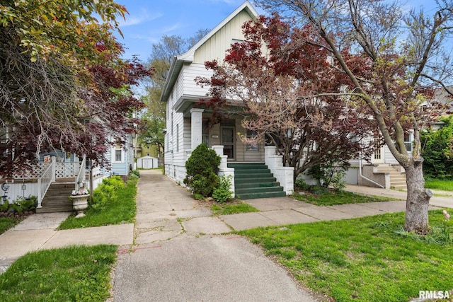 1803 W Barker Ave, Peoria, IL 61606 - view of front facade with a porch, stairs, and driveway
