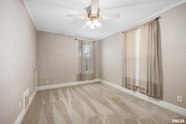 1803 W Barker Ave, Peoria, IL 61606 - spare room with ornamental molding, ceiling fan, carpet flooring, and baseboards