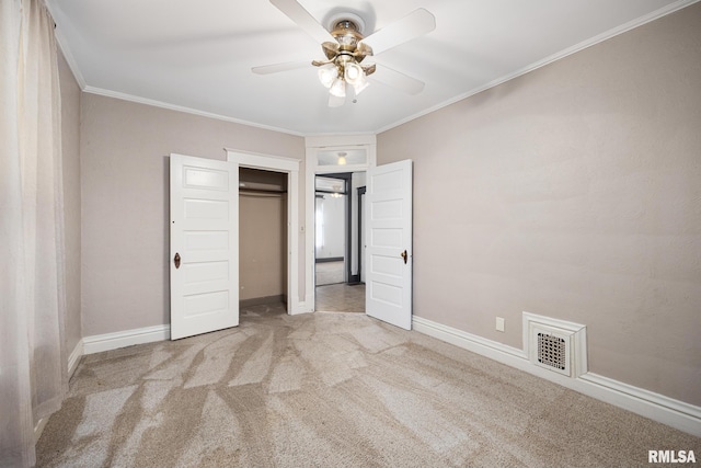 1803 W Barker Ave, Peoria, IL 61606 - unfurnished bedroom featuring carpet flooring, crown molding, baseboards, a closet, and a ceiling fan