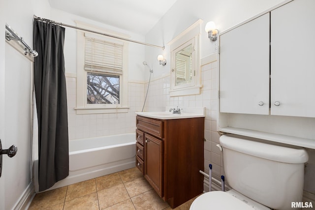 1803 W Barker Ave, Peoria, IL 61606 - bathroom with toilet, tile patterned floors, shower / bath combo, vanity, and tile walls