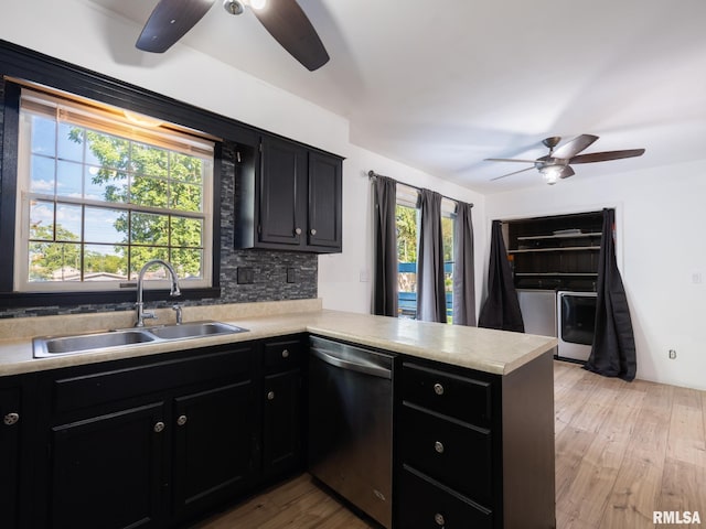 106 N 5th St, Dunlap, IL 61525 - kitchen with stainless steel dishwasher, ceiling fan, independent washer and dryer, and dark cabinets