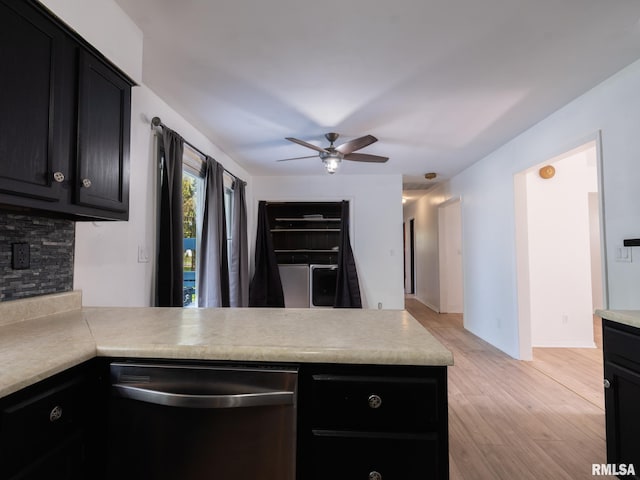 106 N 5th St, Dunlap, IL 61525 - kitchen featuring stainless steel dishwasher, dark cabinetry, a peninsula, ceiling fan, and backsplash