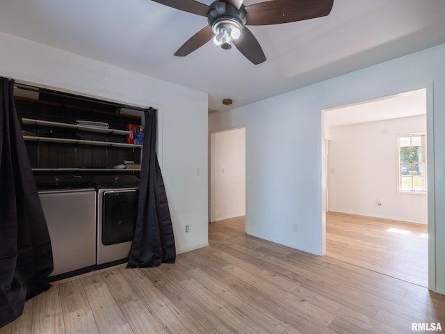 106 N 5th St, Dunlap, IL 61525 - kitchen with washer and dryer, light wood finished floors, and a ceiling fan