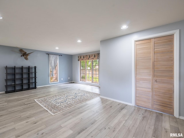 106 N 5th St, Dunlap, IL 61525 - unfurnished living room with wood finished floors and recessed lighting