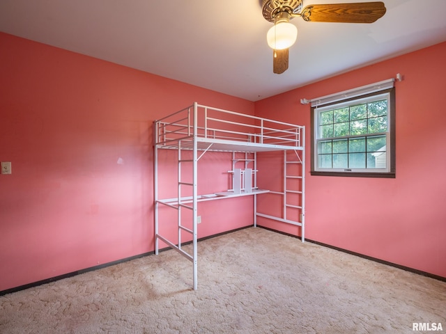 106 N 5th St, Dunlap, IL 61525 - unfurnished bedroom with carpet floors and ceiling fan