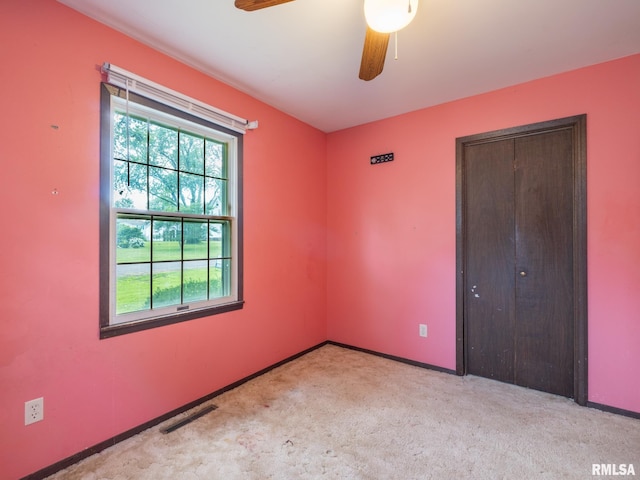 106 N 5th St, Dunlap, IL 61525 - unfurnished bedroom featuring a closet, carpet floors, and a ceiling fan
