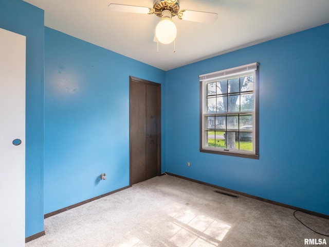 106 N 5th St, Dunlap, IL 61525 - carpeted spare room featuring baseboards and a ceiling fan