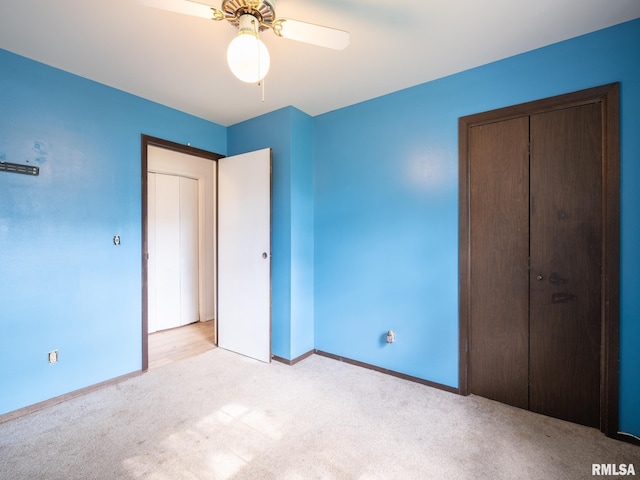 106 N 5th St, Dunlap, IL 61525 - unfurnished bedroom with light colored carpet, ceiling fan, and a closet