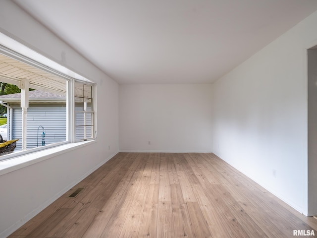 106 N 5th St, Dunlap, IL 61525 - empty room featuring light wood-style floors and baseboards
