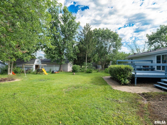 106 N 5th St, Dunlap, IL 61525 - view of yard featuring a playground and a deck
